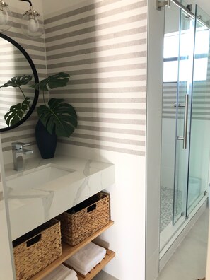 Shower, hair dryer, towels, soap