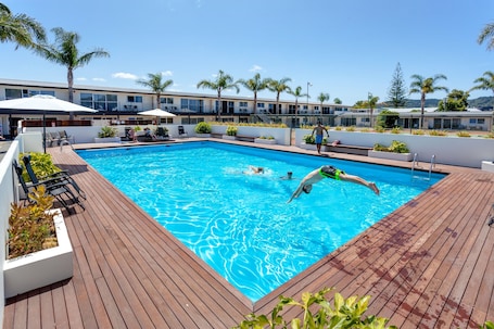 Seasonal outdoor pool, open 7:00 AM to 9:00 PM, pool umbrellas