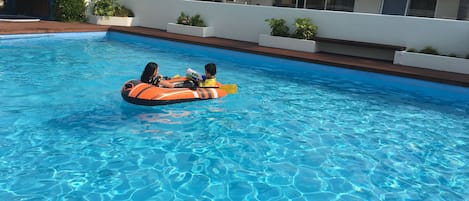 Seasonal outdoor pool, open 7:00 AM to 9:00 PM, pool umbrellas