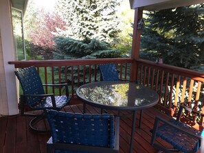 Relax on the deck surrounded by lush gardens and enjoy the serene views.