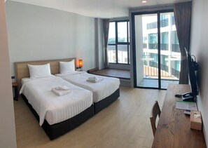 Habitación Deluxe con 2 camas individuales | Ropa de cama de alta calidad y caja de seguridad en la habitación