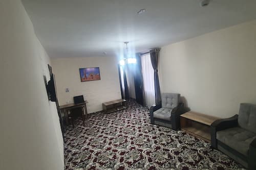Deluxe Double Room | Living area | Flat-screen TV
