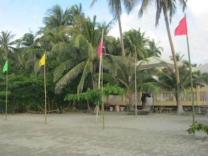Praia particular, prática de vôlei de praia