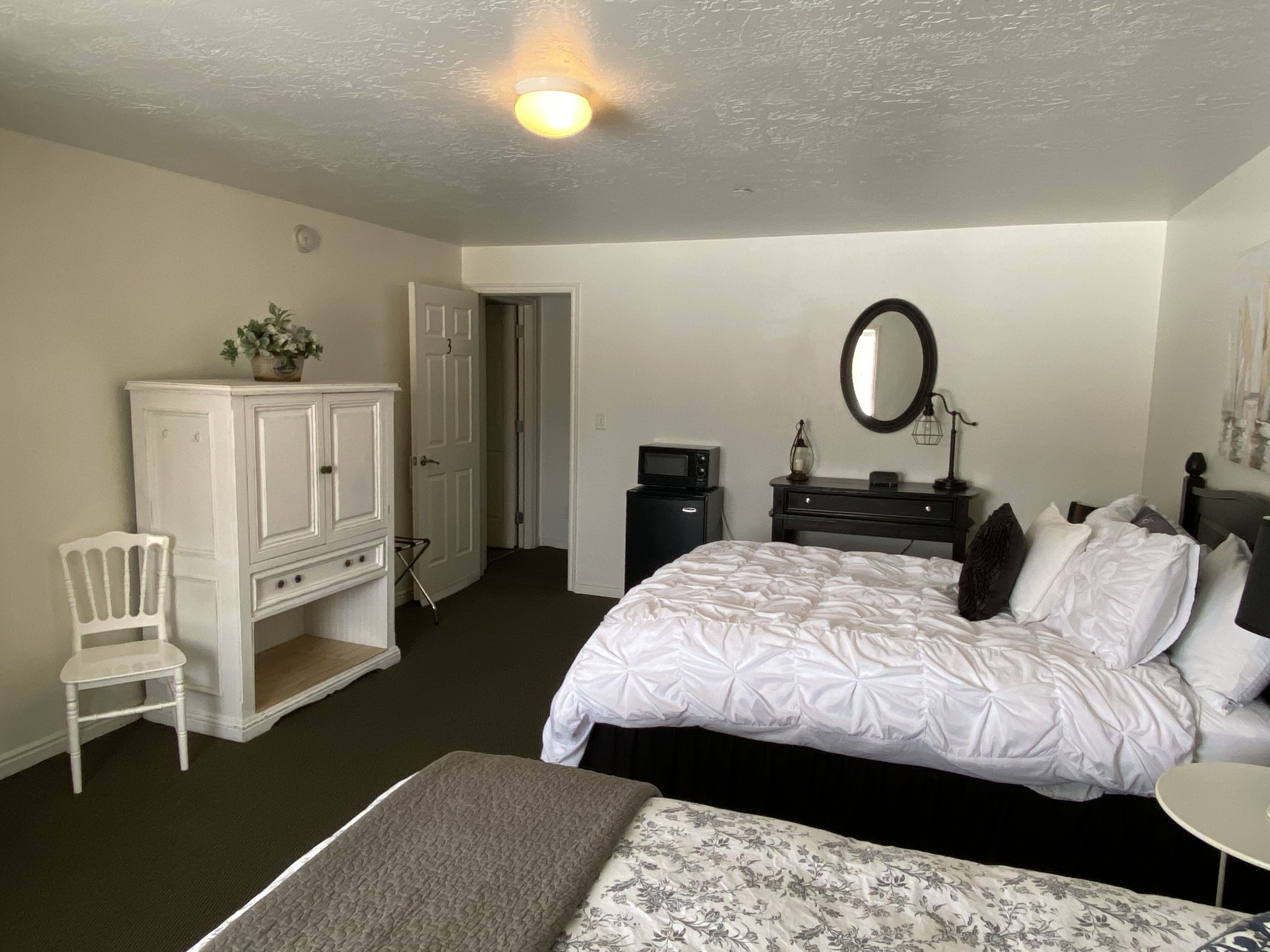 comfort room, 2 queen beds, garden view | memory-foam beds, blackout curtains, iron/ironing board, free wifi