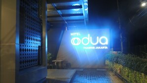 The exterior of Hotel Dua with a prominent illuminated sign. - Odua Thamrin Jakarta (Jakarta)