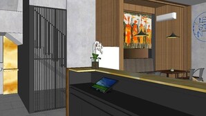 A modern reception area with a desk, a laptop, a potted plant, and a wall with a motivational quote. - Odua Thamrin Jakarta (Jakarta)