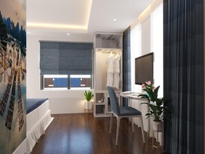 Een moderne slaapkamer met een groot raam, een bureau met een computer, een stoel en een kledingkast.