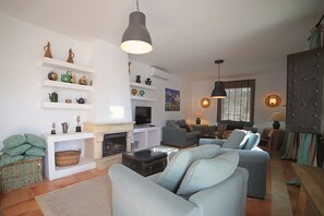 Family House, 2 Bedrooms (Casa del Guarda) | Living area | TV - Hacienda El Rosalejo (Villamartin)