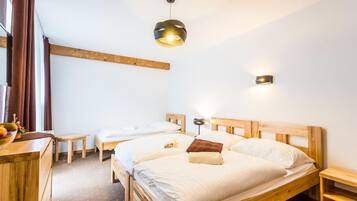 Premium bedding, desk, laptop workspace, blackout curtains