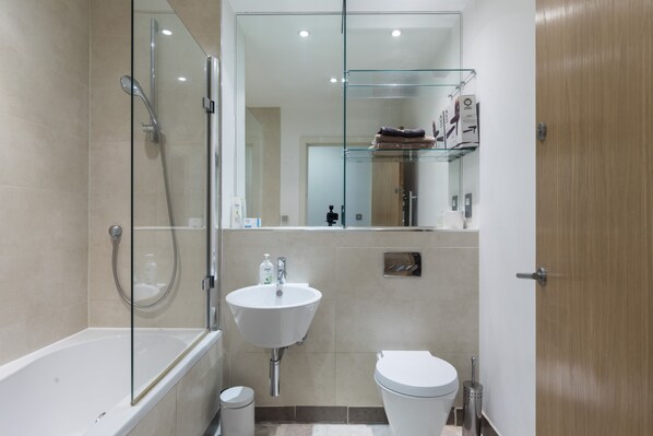 Combined shower/tub, hair dryer, towels, soap