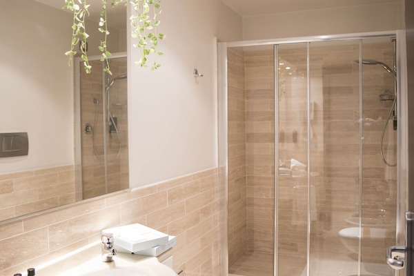 Comfort Room | Bathroom | Shower, rainfall showerhead, eco-friendly toiletries, hair dryer