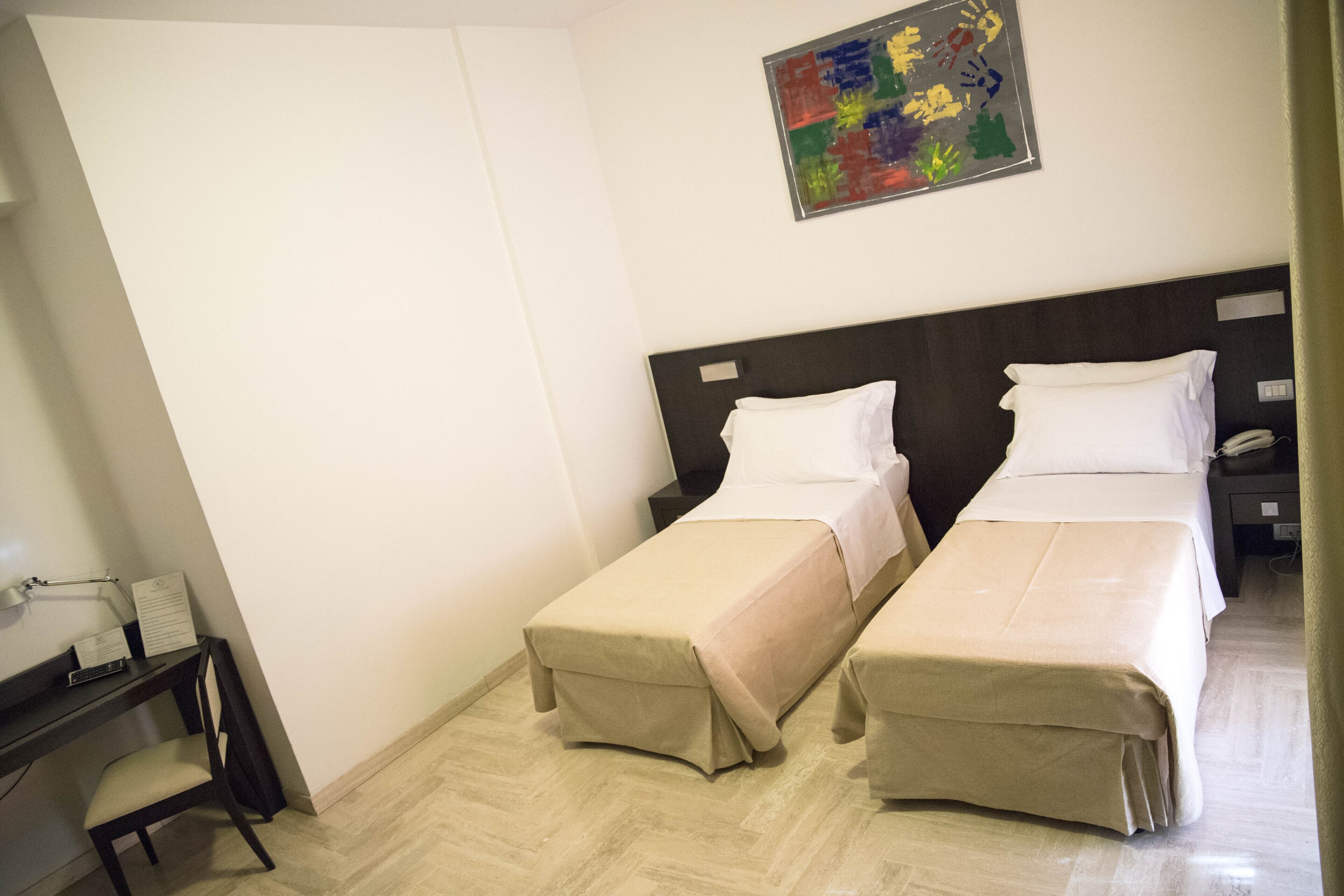 twin room, 2 single beds | 1 bedroom, desk, laptop workspace, blackout curtains