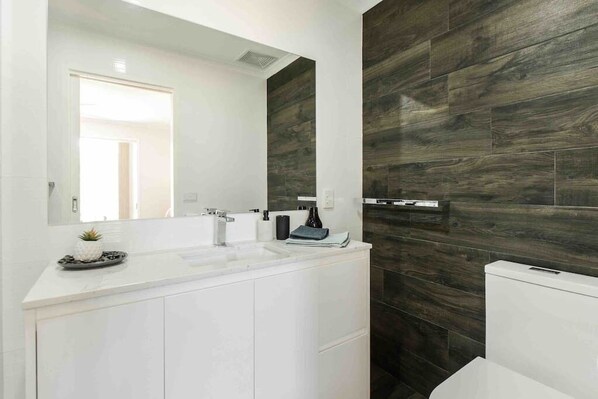 Bathtub, hair dryer, towels