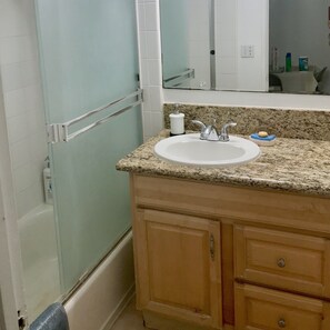 Combined shower/bathtub, hair dryer, towels, soap