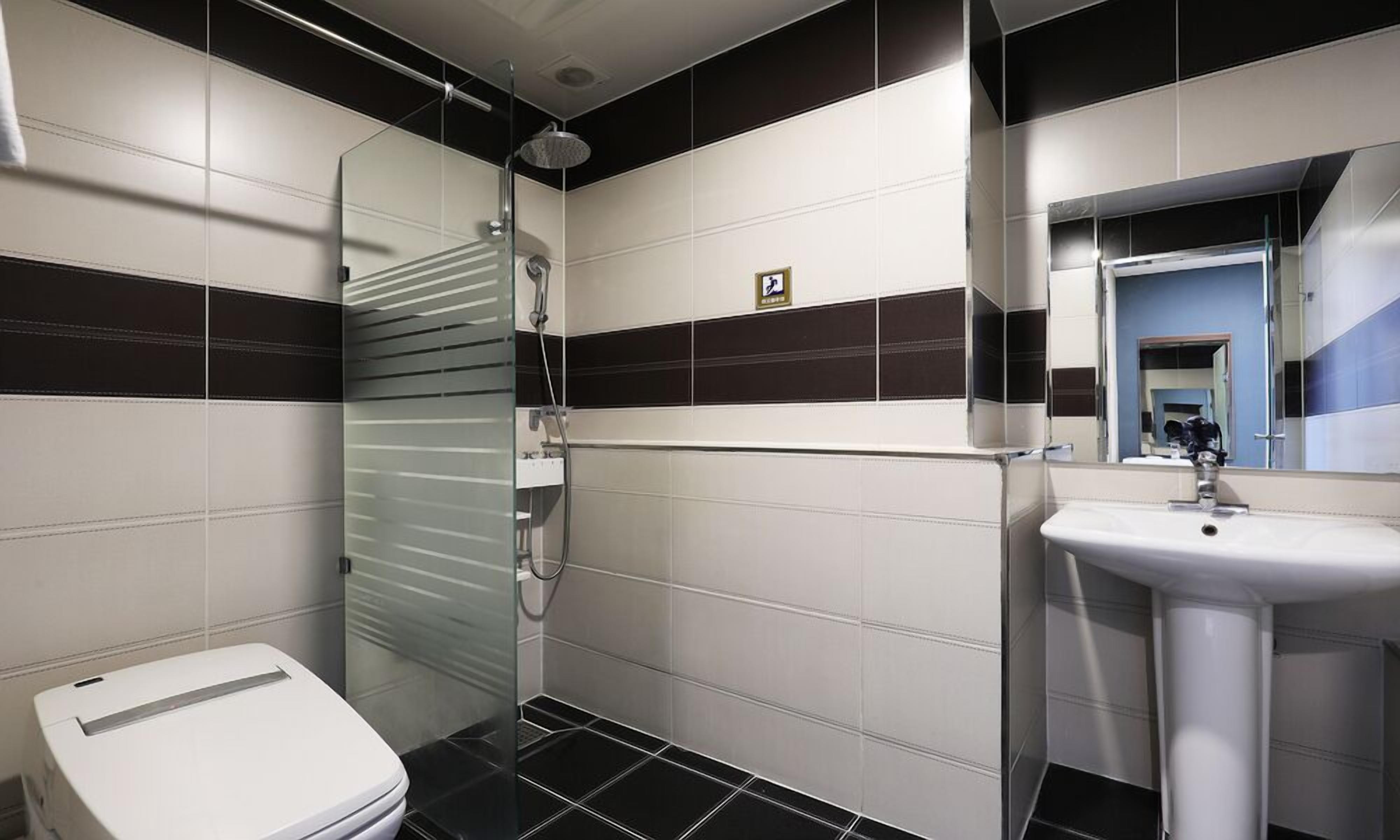 deluxe twin | bathroom | shower, free toiletries, hair dryer, bathrobes