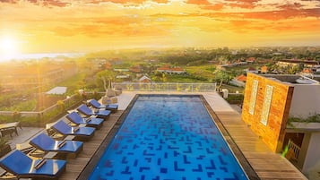 Outdoor pool, open 10:00 AM to 11:00 PM, pool umbrellas