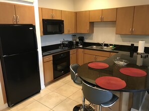 Microwave, dishwasher, coffee/tea maker, cookware/dishes/utensils