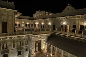 A multi-story building with ornate architectural details and multiple balconies. - The Legacy Mandawa (Jhunjhunu)