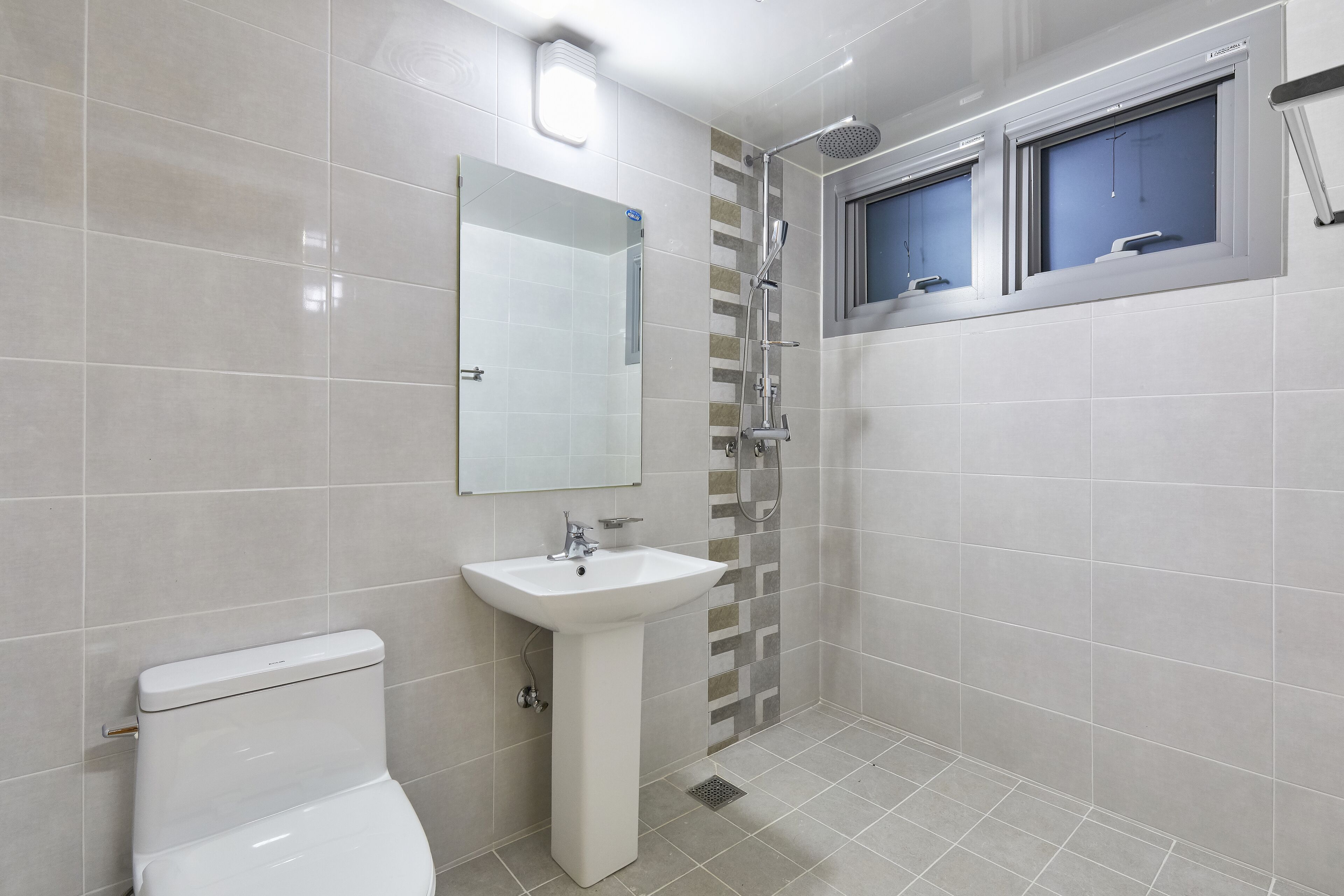 shower, hair dryer, towels, toilet paper