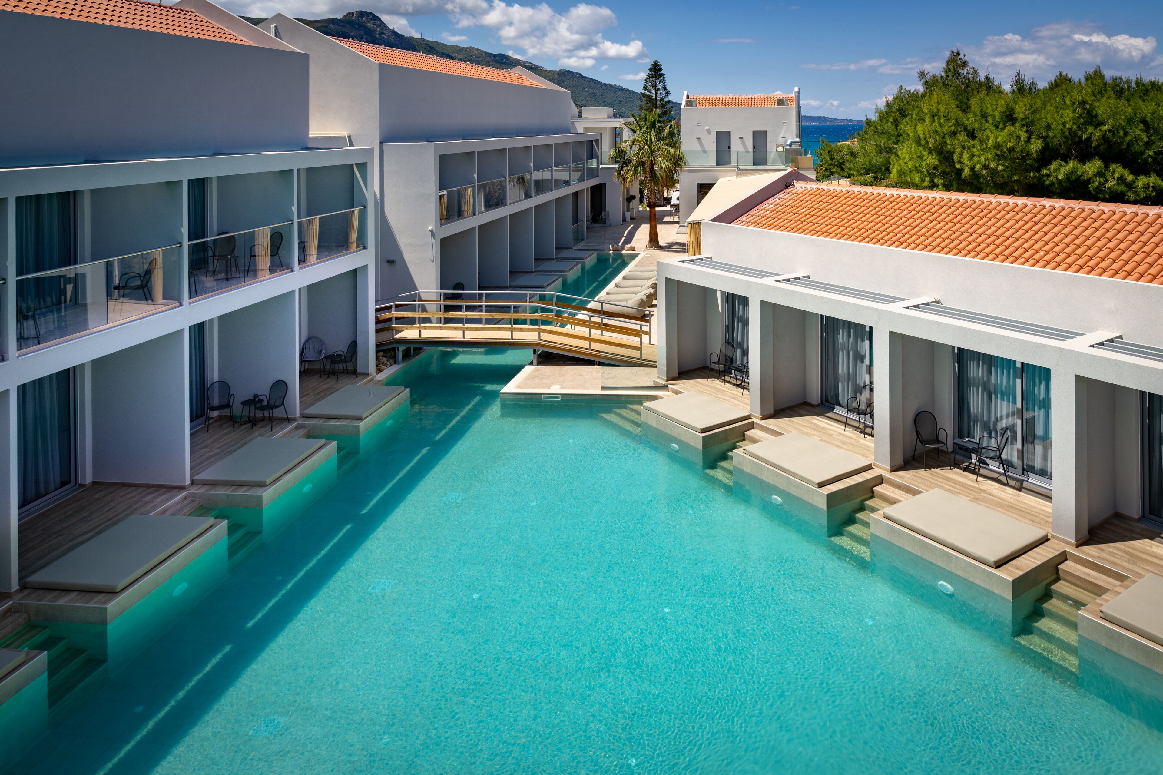 Seasonal outdoor pool, open 8:00 AM to 8:00 PM, pool umbrellas