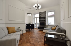 Apartamento superluxo | Sala de estar | TV de tela plana