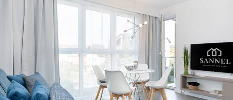 Apartment, 1 Bedroom | Living room | Flat-screen TV