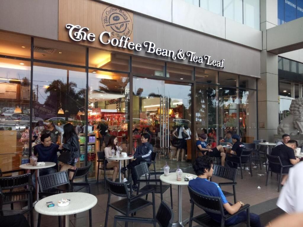 The Coffee Bean & Tea Leaf storefront with outdoor seating.