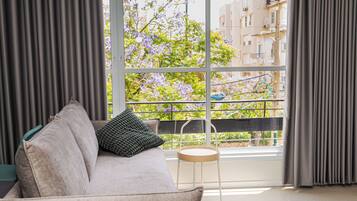 Design Apartment | Living area | 65-inch LCD TV with digital channels, TV