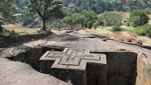 A large, ancient stone structure with a maze-like design carved into it. - Lalibela Roha Tour (Lalibela)