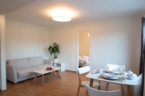 Apartment, 1 Bedroom | Living area | 9999-cm flat-screen TV with digital channels, Smart TV