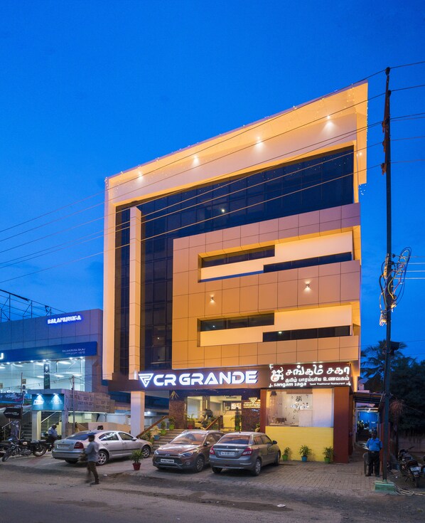 A modern building with a large sign for CR GRANDE, a traditional restaurant. - Hotel CR Grande (Madurai)