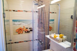 Luxury Apartment | Bathroom | Hair dryer, bathrobes, slippers, towels