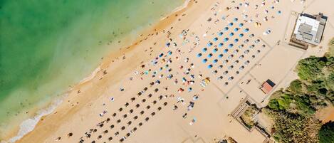 On the beach, sun-loungers, beach towels