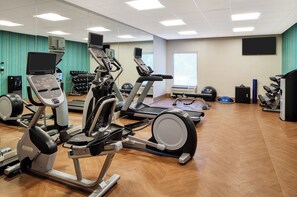 A gym with various exercise equipment including treadmills, elliptical machines, and free weights. - Holiday Inn Express Statesboro by IHG (Statesboro)