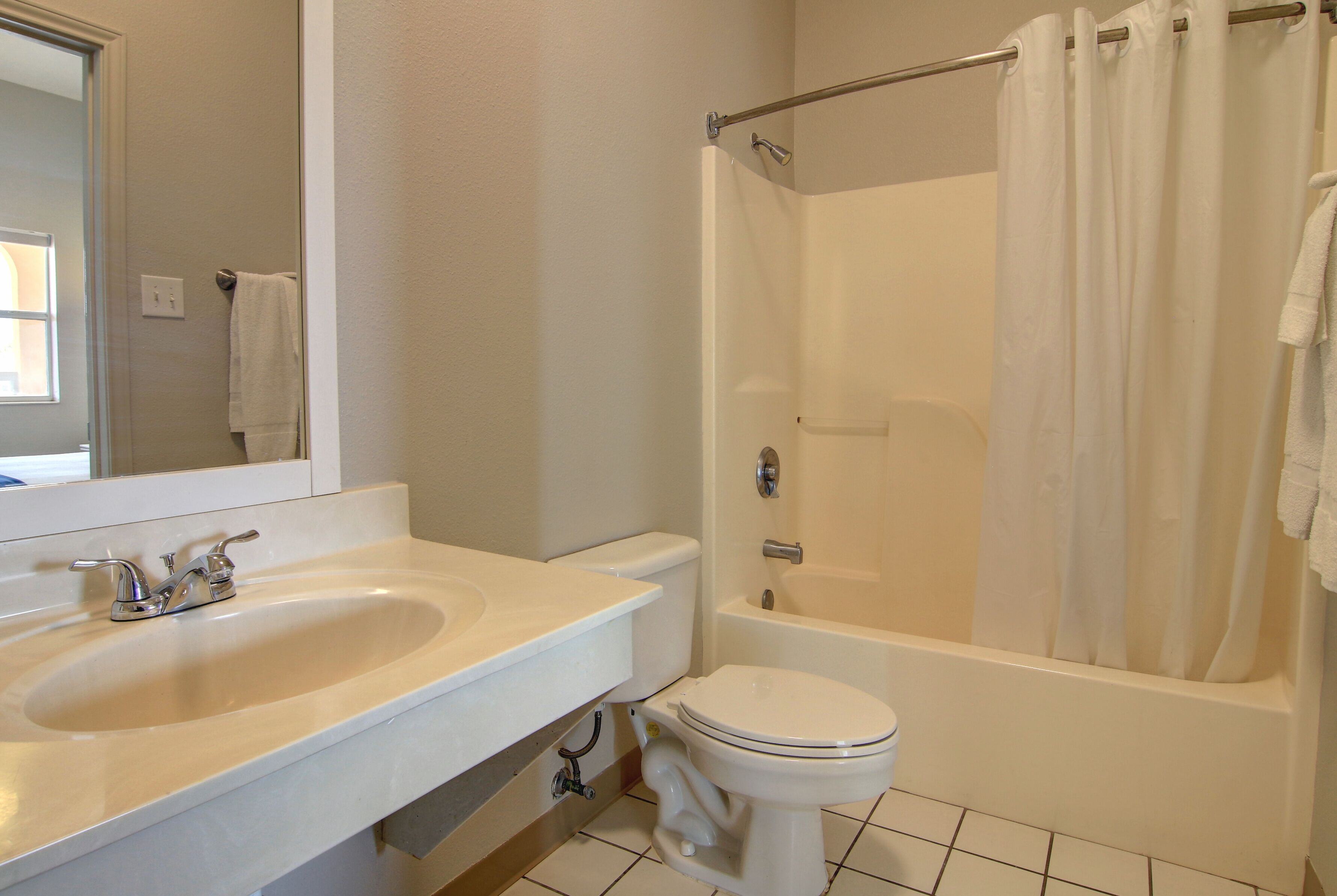 two-bedroom suite | bathroom | free toiletries, hair dryer, towels
