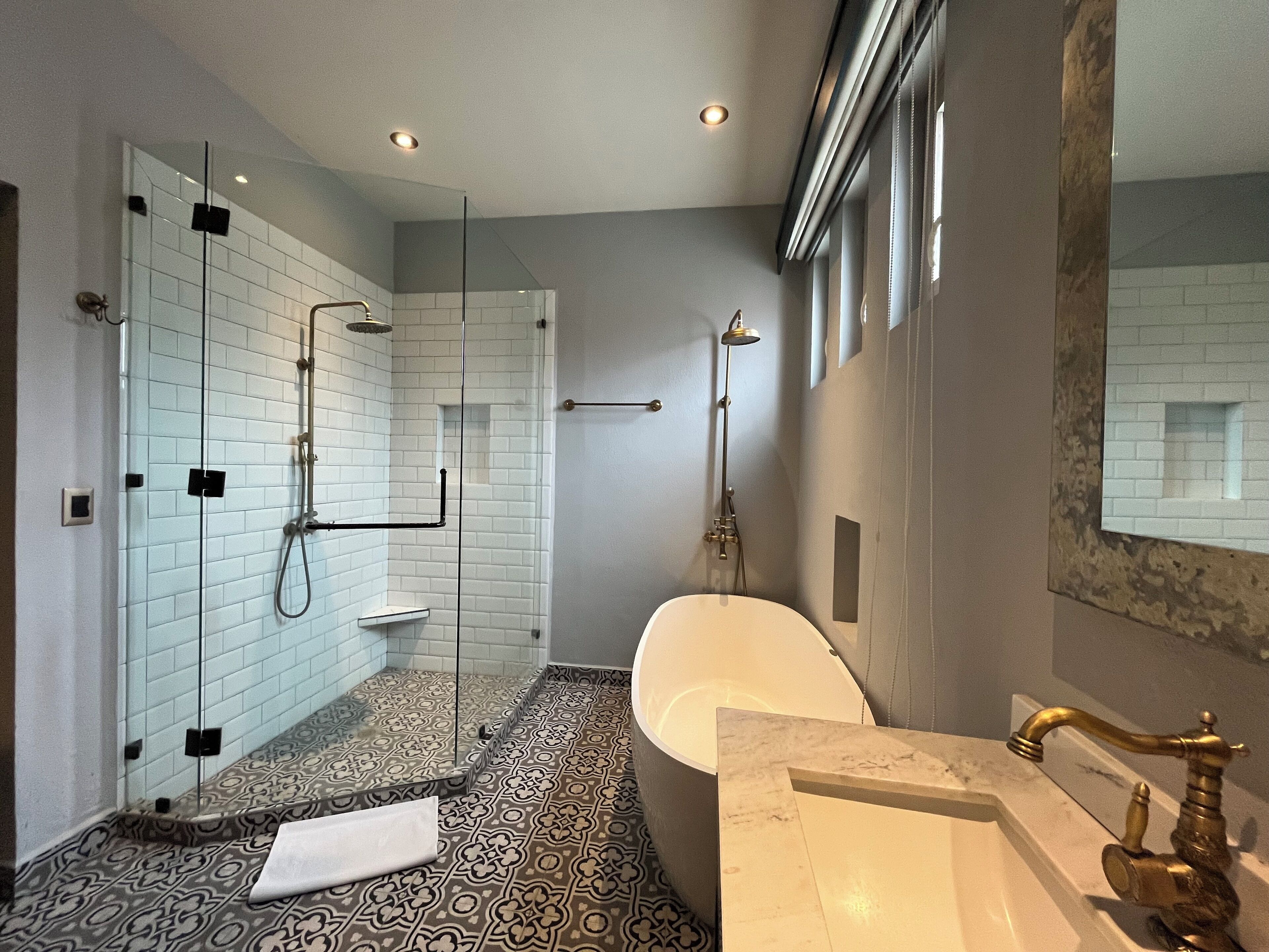 deluxe king size | bathroom | shower, hair dryer, towels, soap