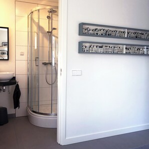 Shower, hair dryer, towels, toilet paper