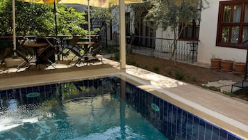 Outdoor pool, pool umbrellas, sun loungers