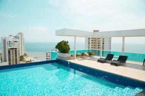 Outdoor pool, open 8:00 AM to 8:00 PM, free cabanas