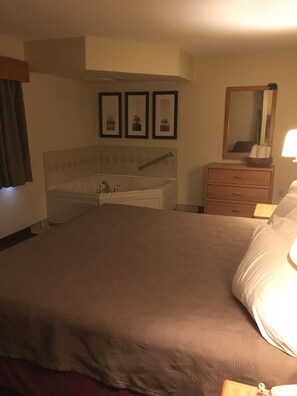 2 Room Suite, 1 King Bed and Sofa Bed, Jetted Tub | Blackout drapes, soundproofing, iron/ironing board, free WiFi