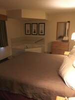 2 Room Suite, 1 King Bed and Sofa Bed, Jetted Tub | Blackout drapes, soundproofing, iron/ironing board, free WiFi
