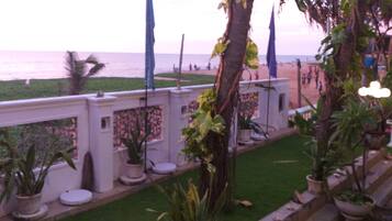 On the beach, white sand, sun-loungers, beach umbrellas