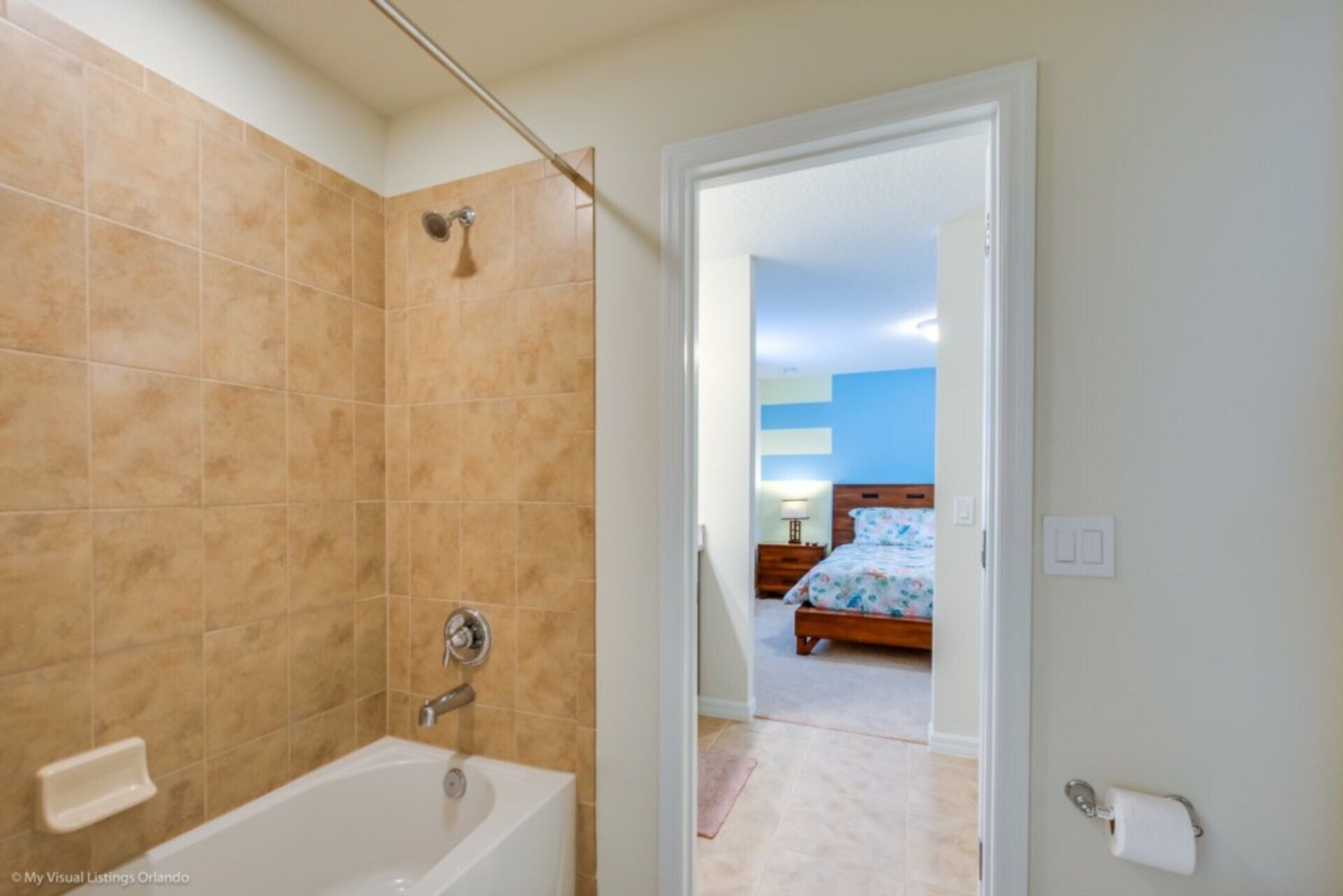 A bathroom with a bathtub, shower, and toilet.
