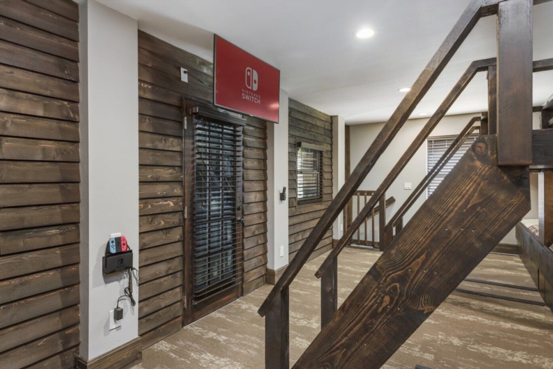 A staircase with wooden railings leading to an upper floor.
