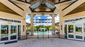 A covered outdoor area with a pool, two doors labeled "3901", and a warning sign about lifeguard duty. - 5 Star Private Villa, Sonoma Resort, Orlando Villa 3094 (Kissimmee)