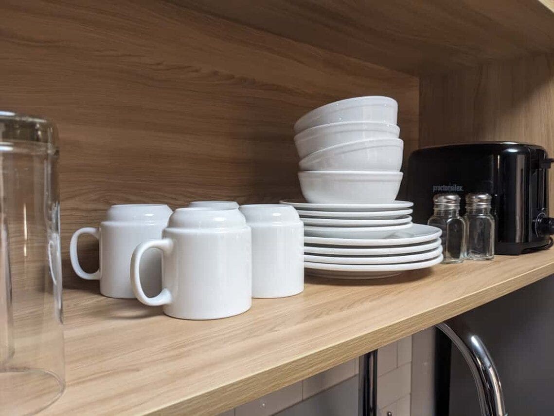 Desk, laptop workspace, blackout drapes, iron/ironing board