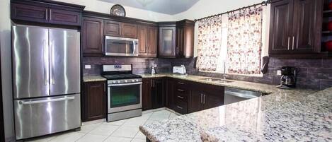 Villa (6 Bedrooms) | Private kitchen | Oven, stovetop, espresso maker, cookware/dishes/utensils