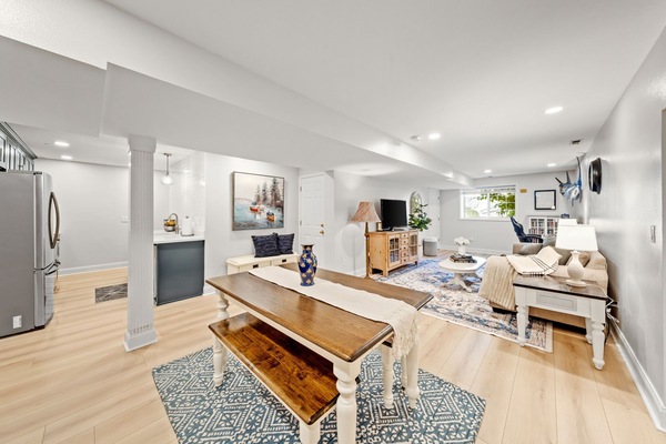 Open floor plan of living room, dining area, and kitchen.