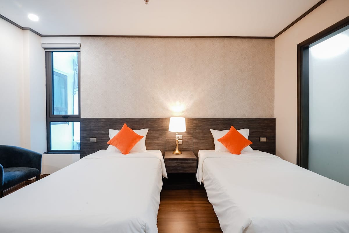 Deluxe Twin Room | Minibar, in-room safe, blackout drapes, free WiFi