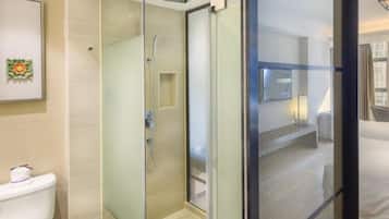 Deep-soaking bathtub, rainfall showerhead, designer toiletries